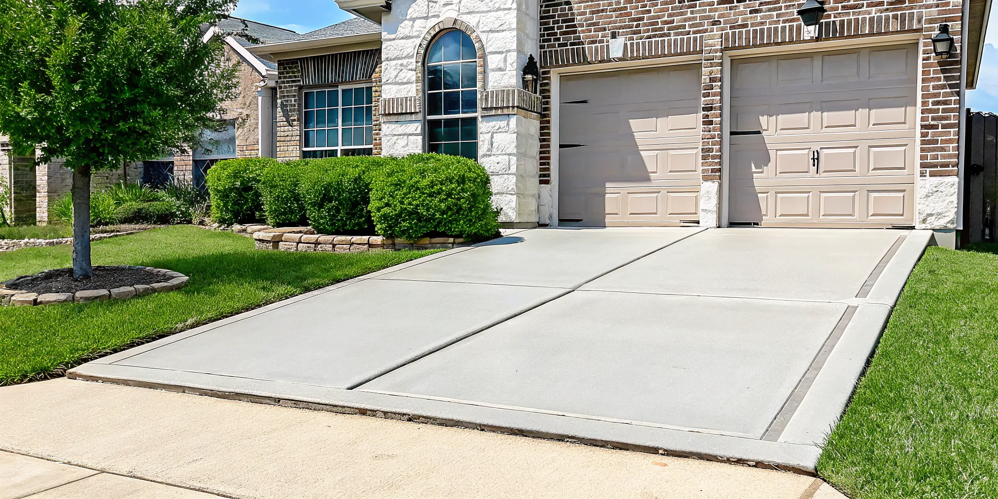 A level concrete driveway in Dallas, TX, after professional concrete leveling.